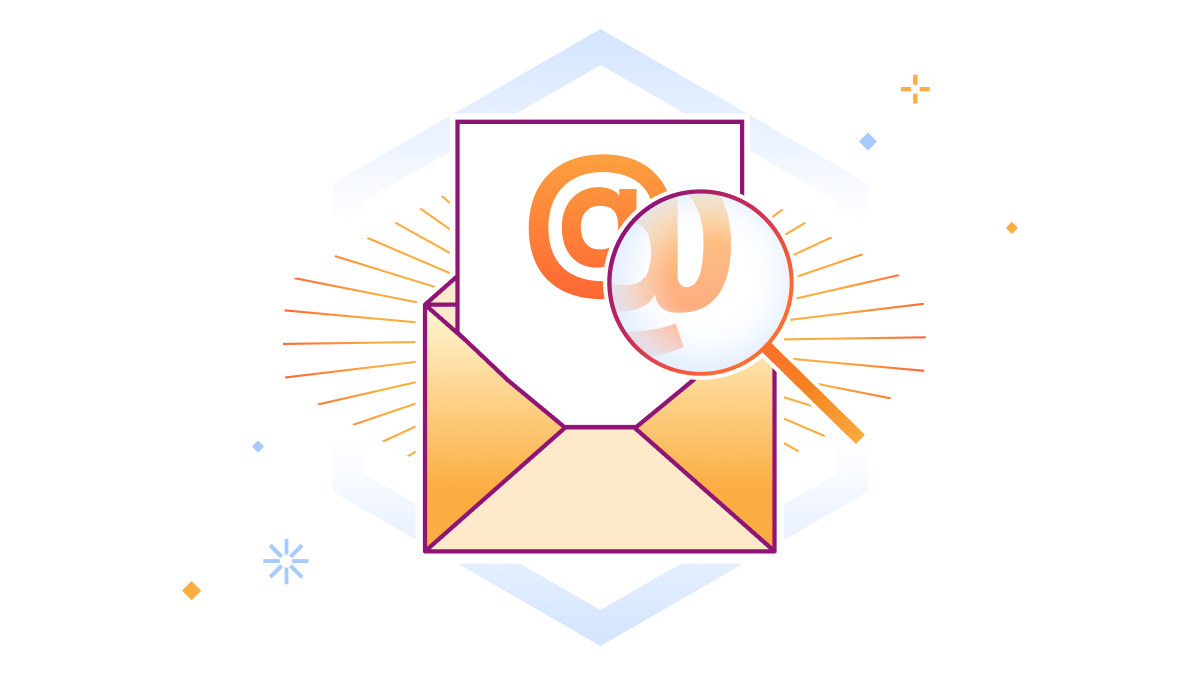 Sinal de e-mail @ ampliado por uma lupa